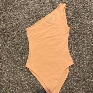 Pastel orange body suit